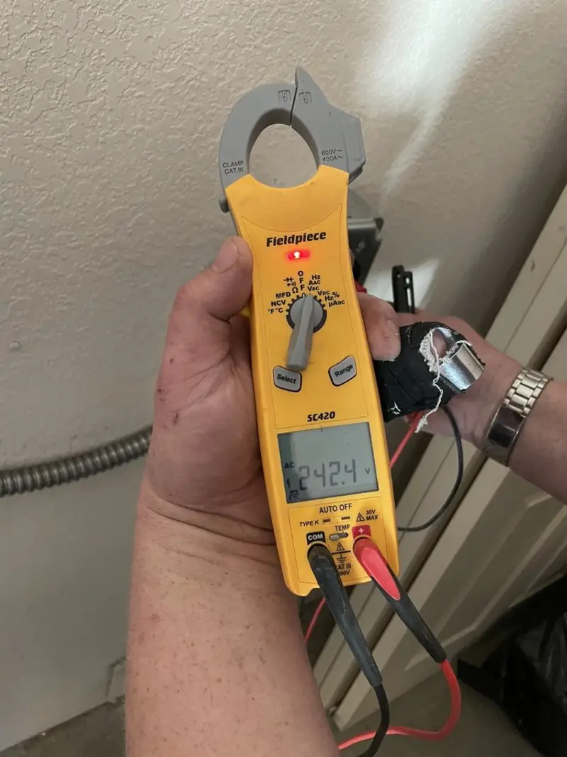 Voltage testing with clamp meter during Electrical Installation Services in Mount Airy